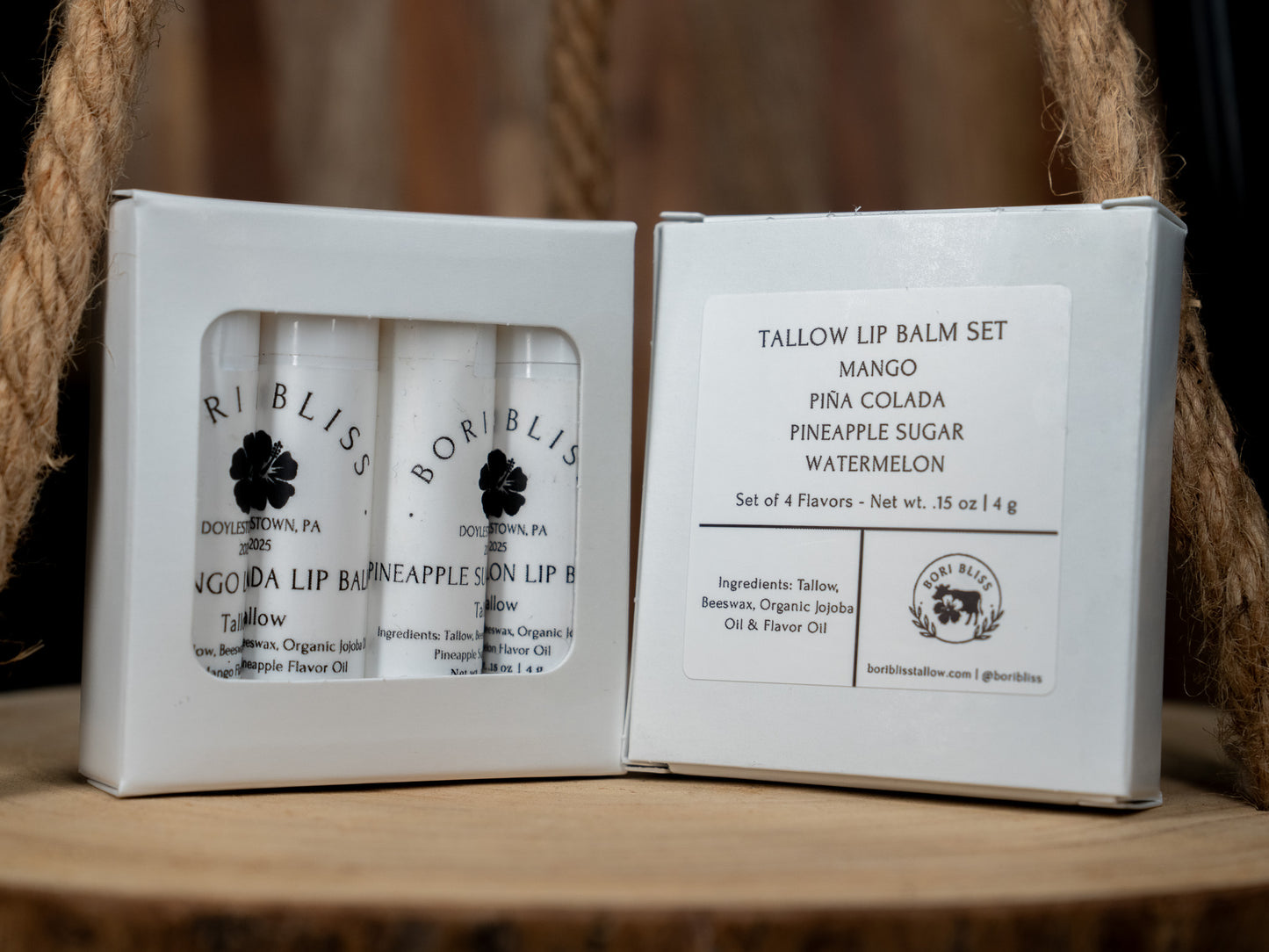 Set of four Bori Bliss tallow lip balm in a box. Mango, pina colada, pineapple sugar, and watermelon.