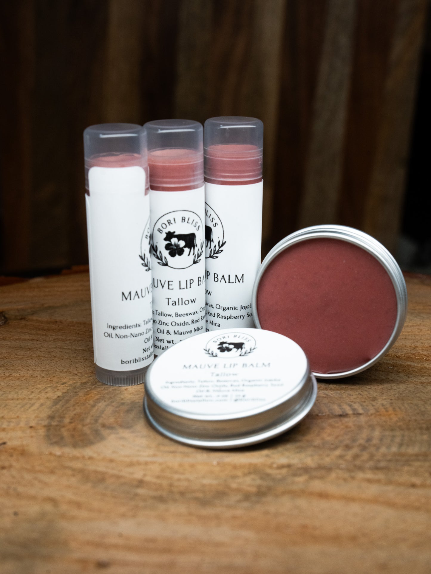 Tinted mauve tallow lip balm tubes and tin from Bori Bliss for a hint of natural color and deep moisture.
